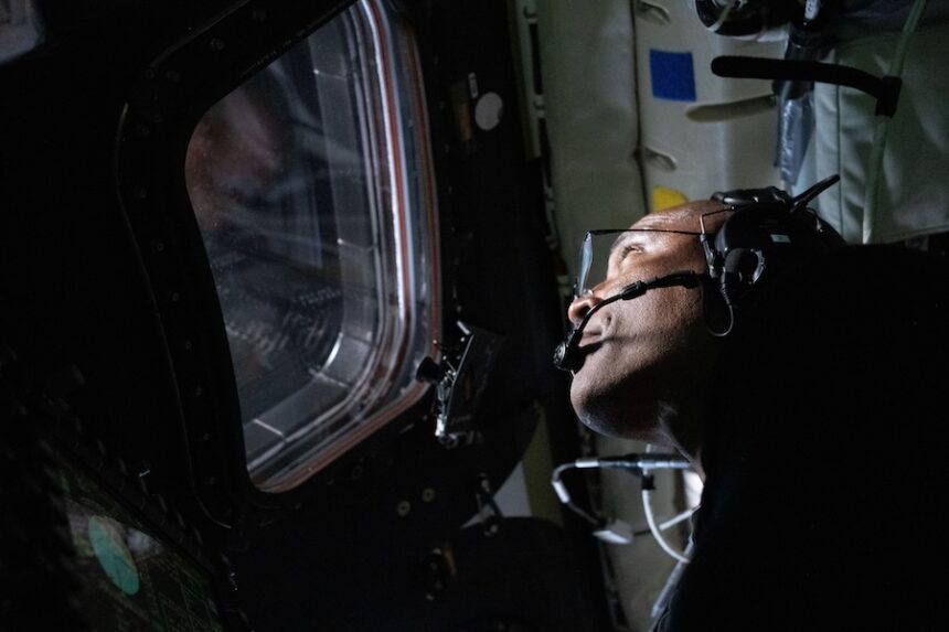 In this image provided by NASA, Artemis II Pilot Victor Glover is photographed in the Orion spacecraft during the Artemis II lunar flyby on Monday, April 6, 2026.