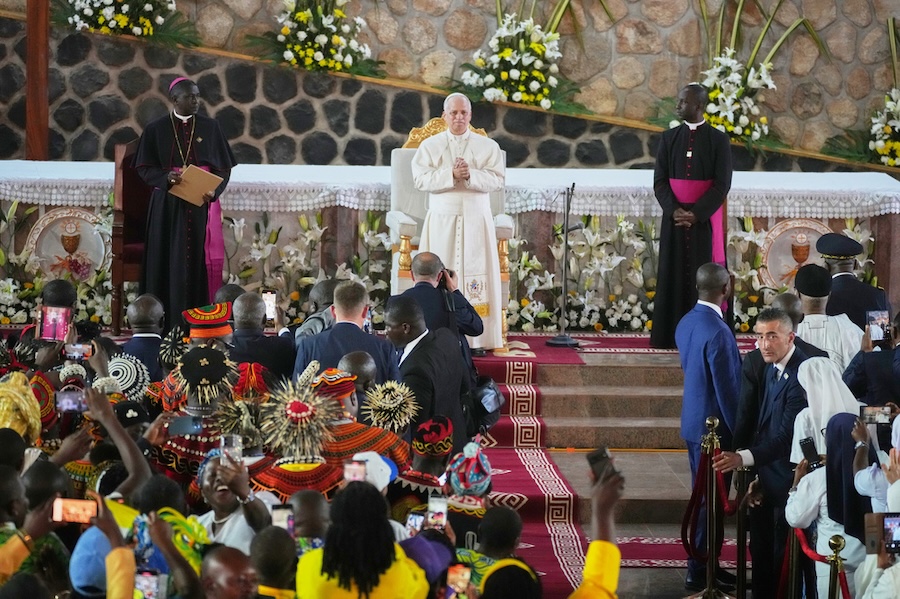 Pope Leo XIV, with the Archbishop of Bamenda, Andrew Nkea Fuanya, left, leads a meeting for peace at Saint Joseph's Cathedral in Bamenda, Cameroon, with the local community Thursday, April 16, 2026, on the fourth day of his 11-day pastoral visit to Africa.