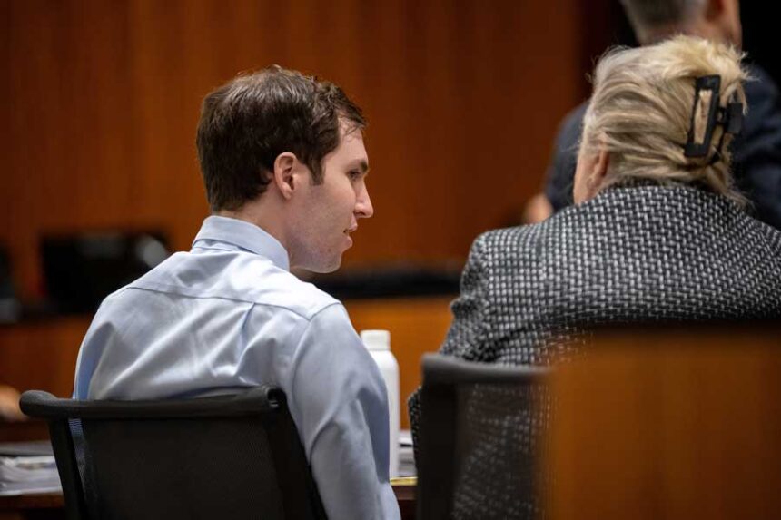Tyler Robinson, left, speaks with his attorney Kathryn Nester in 4th District Court in Provo, Utah, on Friday, April 17, 2026.