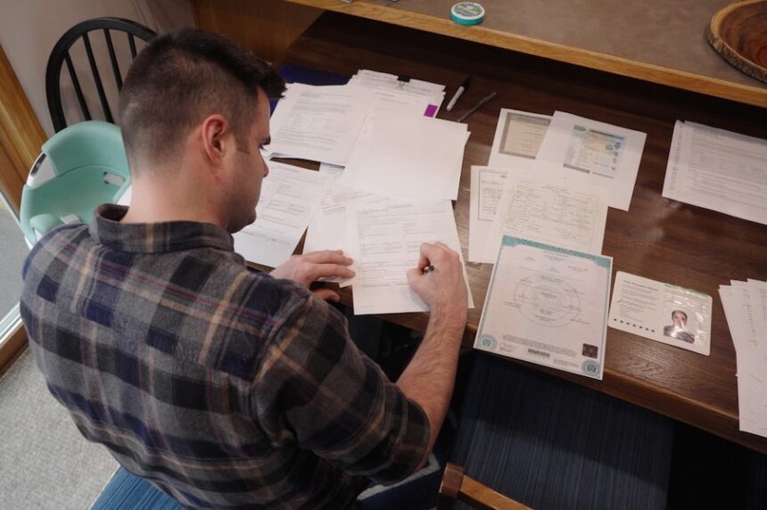 This image made from video shows Zach Loud completing his application for Canadian citizenship at his family's home in Farmington, Minn., April 17, 2026.
