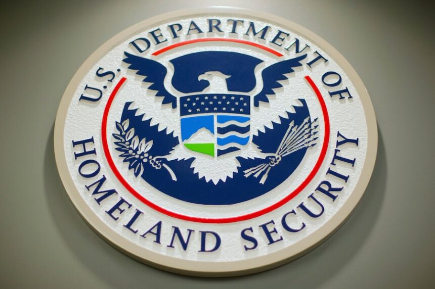 FILE - The Department of Homeland Security logo during a news conference in Washington, Feb. 25, 2015.