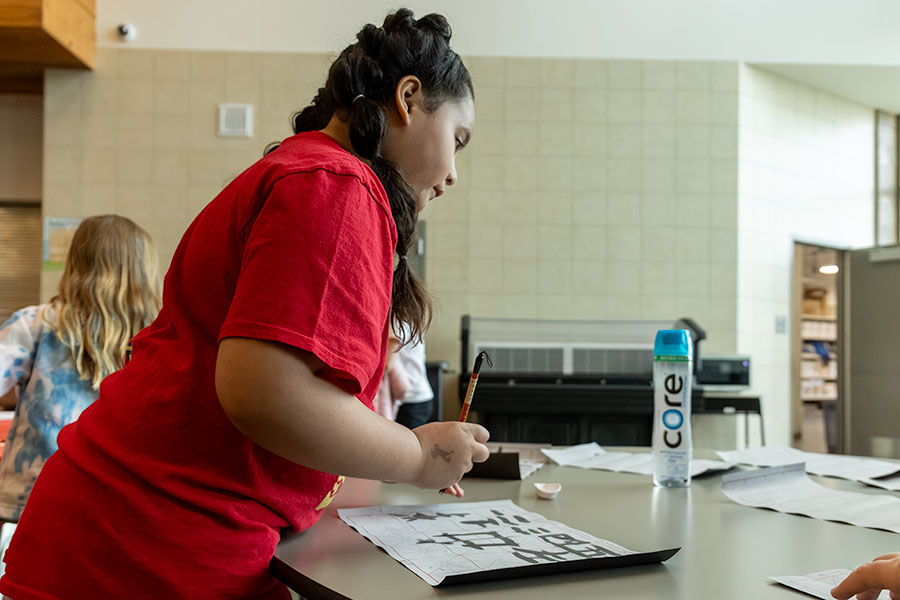 Part of the events during the first Chinese Cultural Event was allowing students and parents to draw their names Chinese Calligraphy. | Daniel V. Ramirez, EastIdahoNews.com