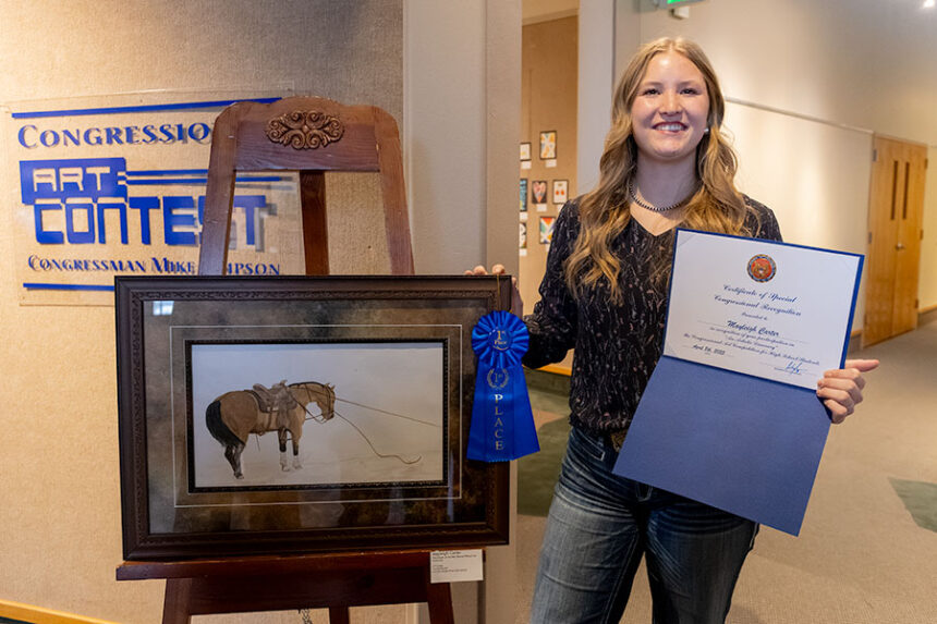 Junior Mayleigh Carter from Snake River High School with her winning piece, “Tied Down at the War Bonnet Rodeo," that will be displayed later this year at the U.S. Capitol Building. | Daniel V. Ramirez, EastIdahoNews.com