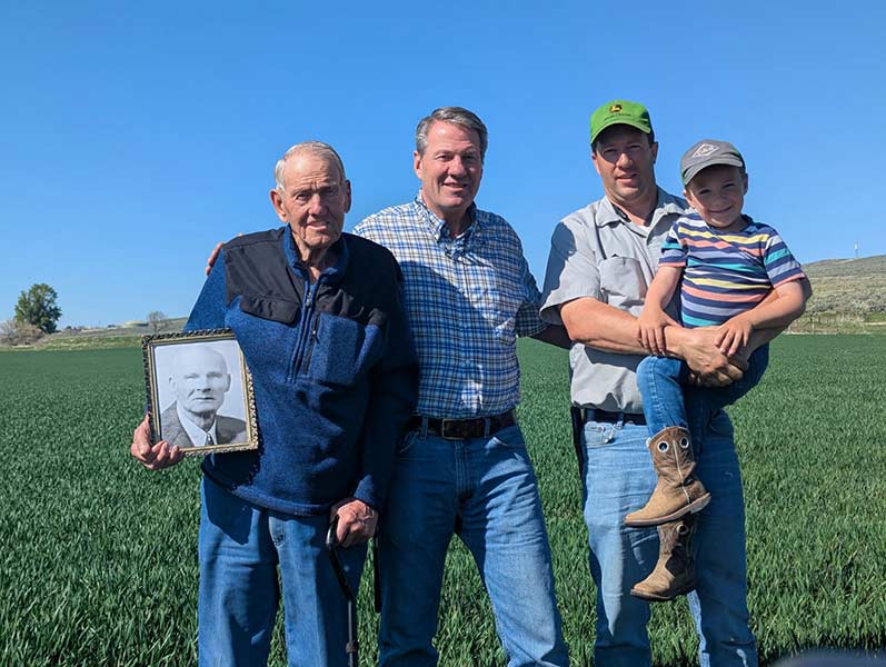 Tim Haderlie, second from left, with his father, left, son, right, and grandson. Haderlie's dad is holding a picture of his dad, Tim's grandfather. | Courtesy Tim Haderlie