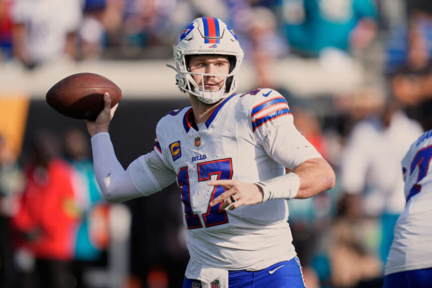 Buffalo Bills quarterback Josh Allen throws a pass during the second half of an NFL wild card game against the Jacksonville Jaguars on January 11 in Florida. | John Raoux/AP via CNN Newsource