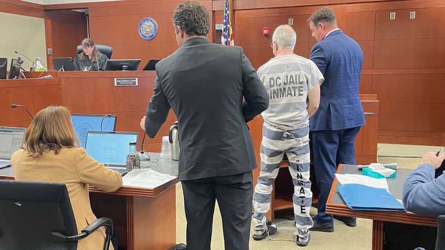 Former Utah Judge Kevin Christensen, in the prison jumpsuit, stands with his attorney Ryan Bushell during a hearing in his own criminal case on Thursday, April 9, 2026, in 2nd District Court in Ogden. He pleaded guilty to three felony charges, one for sexually enticing a minor, as part of a plea deal in his case. (Photo: Tim Vandenack, KSL.com)