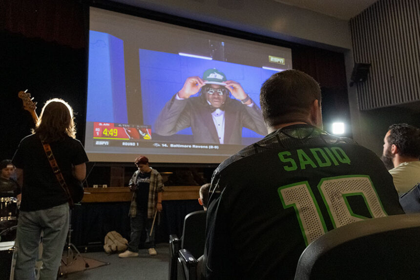 Super Kenyon Sadiq Fan Jimmie Scrogum told EastIdahoSports.com that the jersey he's wearing was signed by Sadiq. He waited with hundreds to see where Sadiq will play in the NFL. | Daniel V. Ramirez, EastIdahoSports.com