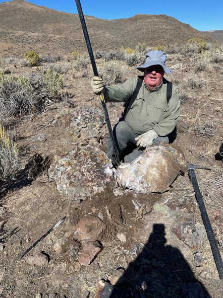Mike Bruton, president of the IFG&MS, with a large jasper and agate rock harvested last summer.