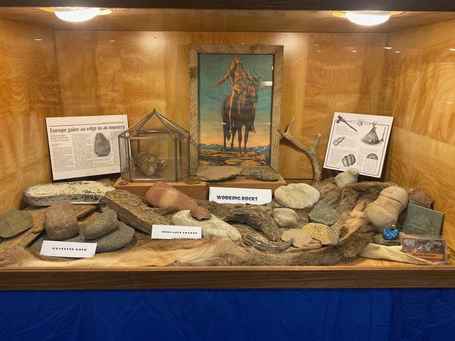 A show case depicting the history of stones use by humans collected by a club member.
