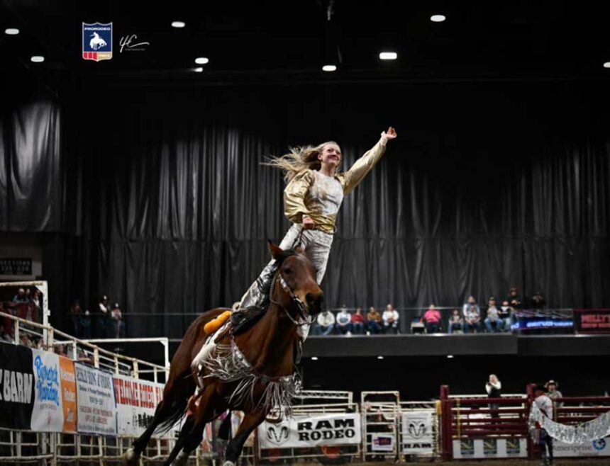 A trick rider performs at a Big Bucks ProRodeo event.