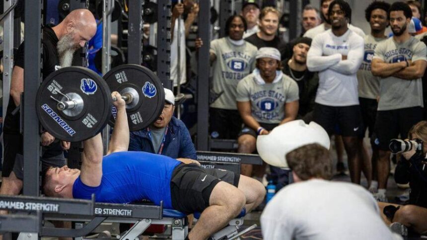 Former Boise State offensive lineman Kage Casey bench presses in front of a group of NFL scouts and cheering teammates at the program’s pro day in March. Darin Oswald doswald@idahostatesman.com