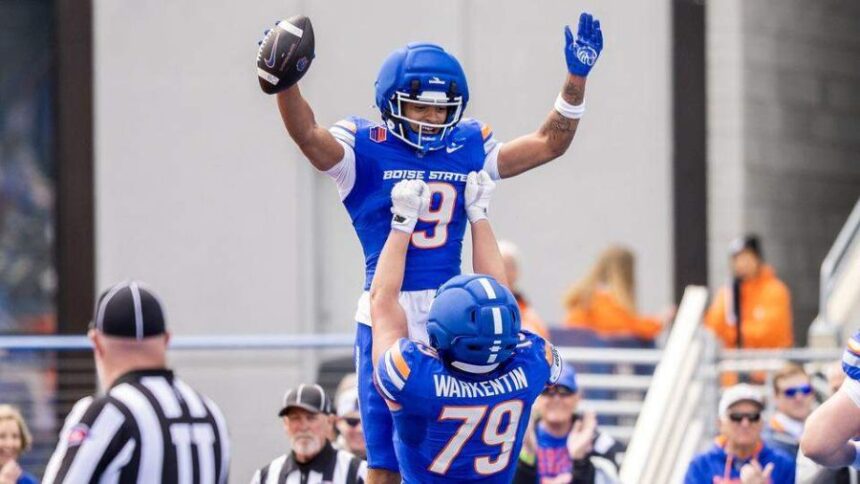 Boise State wide receiver Rasean Jones gets hoisted into the air by offensive lineman Connor Warkentin after catching a touchdown pass Saturday in the spring game. Darin Oswald doswald@idahostatesman.com
