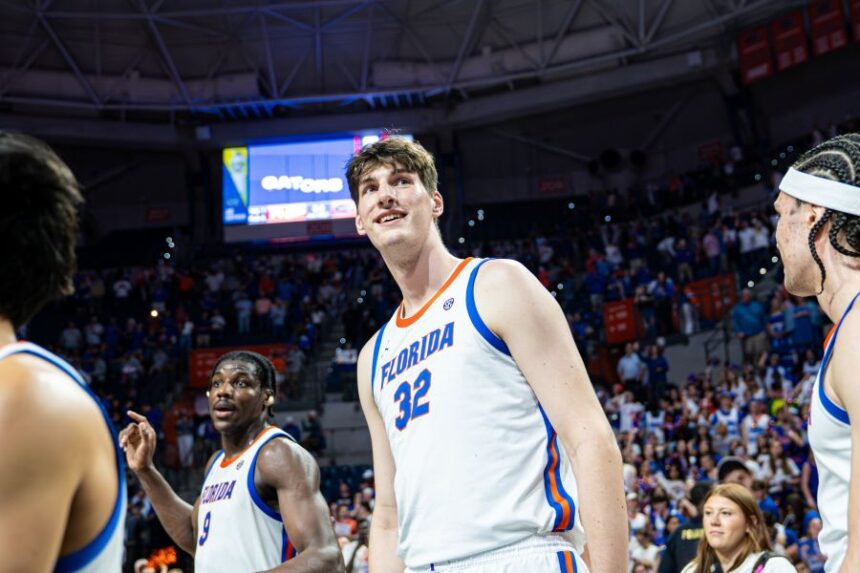 FILE - Florida center Olivier Rioux (32) smiles following their win over Mississippi State during the second half of an NCAA college basketball game on March 3, 2026, in Gainesville, Fla. (AP Photo/Morgan Hurd, File)
