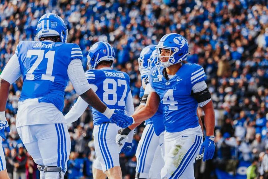 BYU's LJ Martin (4) celebrates a touchdown with teammate Isaiah Jatta during a Big 12 football game against UCF, Saturday, Nov. 29, 2025 at LaVell Edwards Stadium in Provo, Utah. (Photo: Tyler Staten for KSL.com)