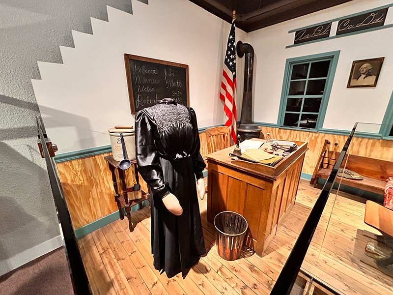 Rebecca Brown Mitchell's dress on display in a representation of her classroom at the Museum of Idaho | Rett Nelson, EastIdahoNews.com