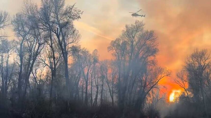 This image taken from video provided by the Madison County Sheriff's Office shows a helicopter crew fighting the Snake Fire on Thursday, April 9, 2026.