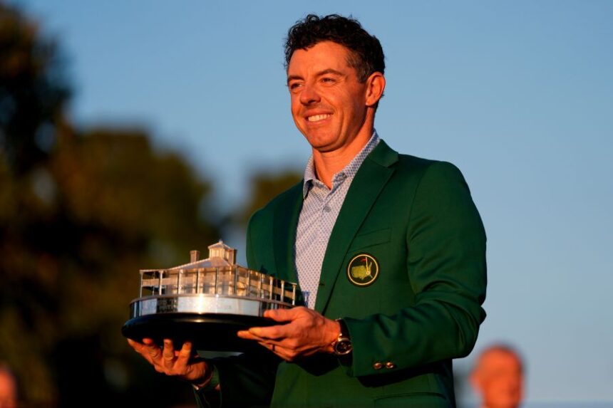 Rory McIlroy, of Northern Ireland, holds the trophy after winning the Masters golf tournament at the Augusta National Golf Club, Sunday, April 12, 2026, in Augusta, Ga.(AP Photo/Ashley Landis)