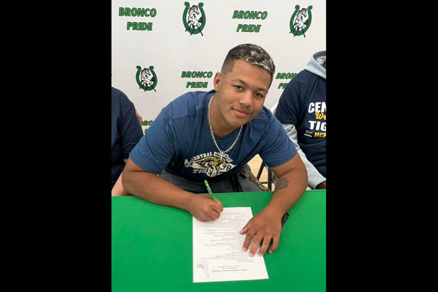 Blackfoot HS Jakeem Ashley signs a letter of intent to attend and wrestle at Central Christian College | courtesy Blackfoot School District 55 on Facebook