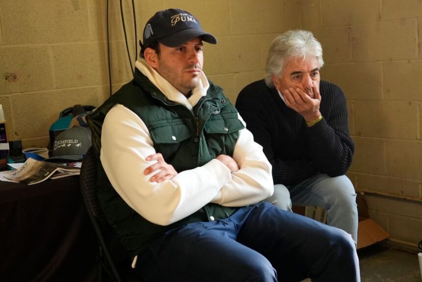 Trainers Gustavo Delgado Sr. and his son Gustavo Delgado Jr. watch a video of workouts after taking their horse, Kentucky Derby entrant The Puma, for a workout at Churchill Downs Thursday, April 30, 2026, in Louisville, Ky. (AP Photo/Charlie Riedel)