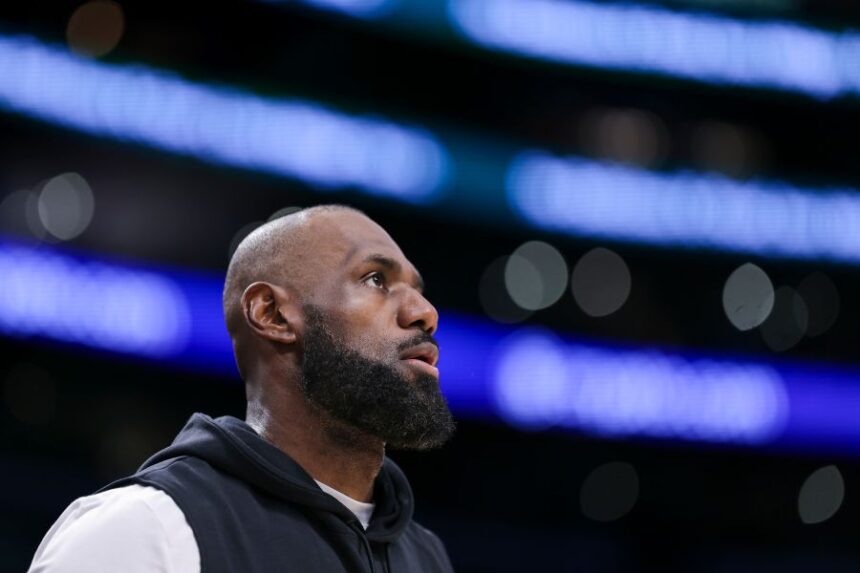 Los Angeles Lakers forward LeBron James looks on before an NBA basketball game against the Phoenix Suns, Friday, April 10, 2026, in Los Angeles. (AP Photo/Jessie Alcheh)