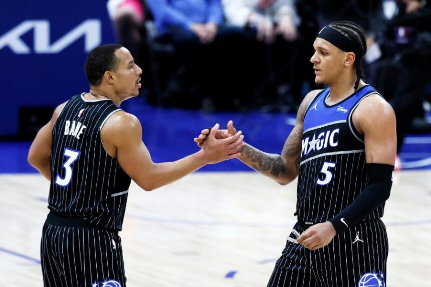 Minnesota Timberwolves guard Bones Hyland (8) celebrates on the bench against the Denver Nuggets during the second half in Game 2 of a first-round NBA playoffs basketball series Monday, April 20, 2026, in Denver. (AP Photo/Jack Dempsey)