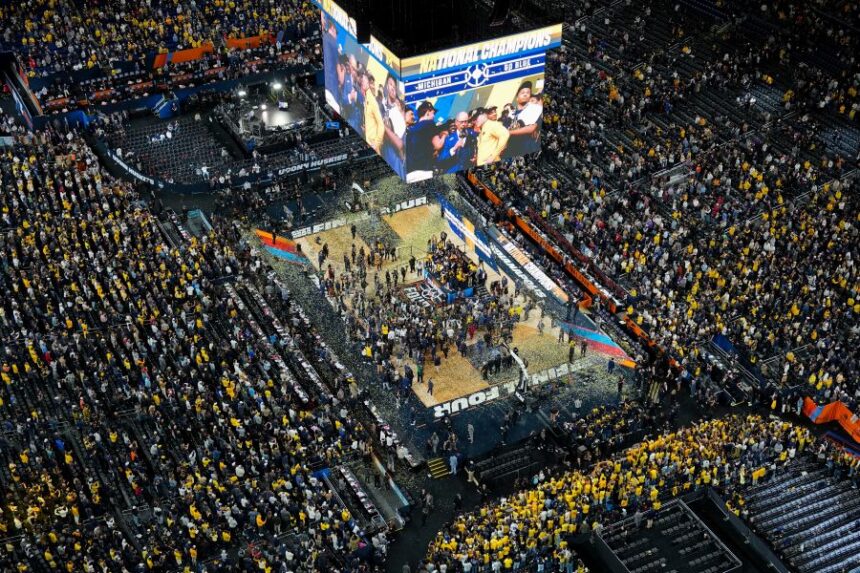 Michigan celebrates after defeating UConn in the NCAA college basketball tournament national championship game at the Final Four, Monday, April 6, 2026, in Indianapolis. (AP Photo/AJ Mast)