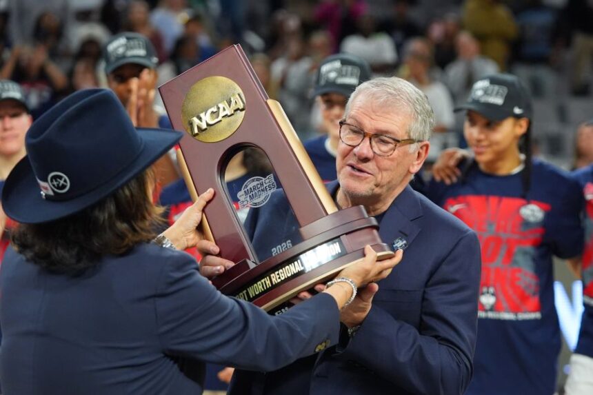 UConn head coach Geno Auriemma is presented with a Fort Worth Regional Champion trophy after his team defeated Notre Dame in the Elite Eight of the NCAA college basketball tournament, Sunday, March 29, 2026, in Fort Worth, Texas. (AP Photo/LM Otero)
