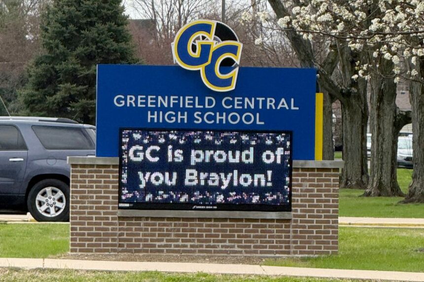 A digital sign outside Greenfield Central High School in Greenfield, Ind., congratulates the UConn men's college basketball team and Greenfield graduate Braylon Mullins, Monday, March 30, 2026, following the Husky's Elite Eight win over Duke in the NCAA Tournament. (AP Photo/Mike Marot)