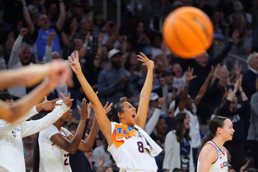 UConn center Jana El Alfy (8) reacts after teammate Blanca QuiÒonez, not visible, scored a three-point basket against the Notre Dame during the second half in the Elite Eight of the NCAA college basketball tournament, Sunday, March 29, 2026, in Fort Worth, Texas. (AP Photo/LM Otero)