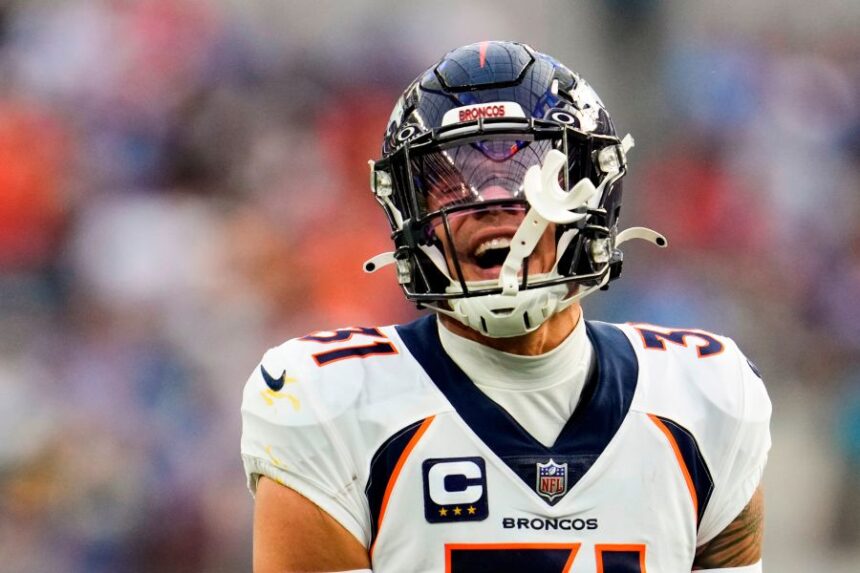 FILE - Denver Broncos safety Justin Simmons (31) reacts to a sack on Los Angeles Chargers quarterback Justin Herbert by teammate Zach Allen during the first half of an NFL football game Sunday, Dec. 10, 2023, in Inglewood, Calif. (AP Photo/Marcio Jose Sanchez, File)
