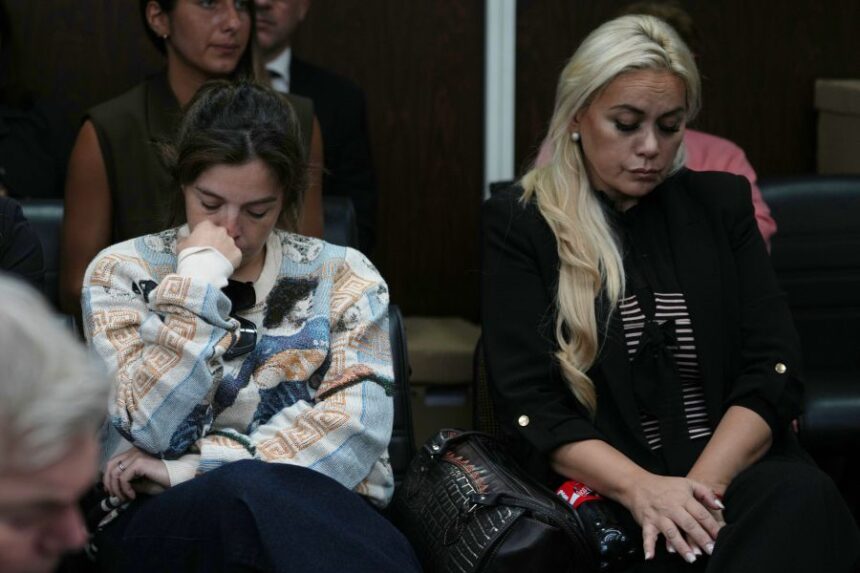 Dalma Maradona, left, the daughter of late Diego Maradona, and Veronica Ojeda, former partner of the late soccer star, attend the first day of the trial of his medical team for alleged homicide by negligence in San Isidro, Argentina, Tuesday, April 14, 2026. (AP Photo/Rodrigo Abd)