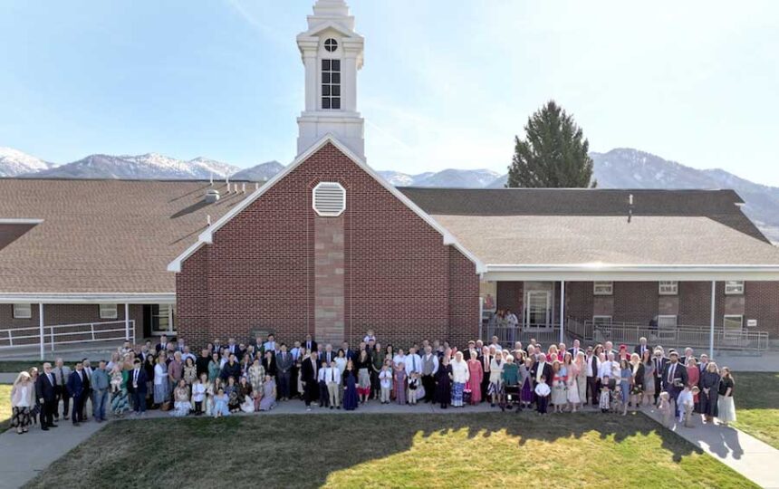 The Etna Ward of The Church of Jesus Christ of Latter-day Saints gathers for a photo after the final Sunday service in this church building on Sunday, March 30, 2026. | Courtesy Seth Warren