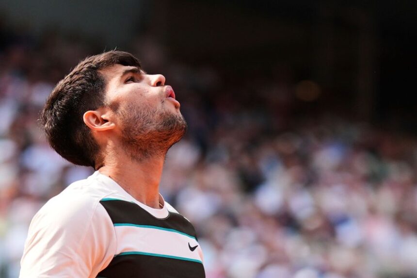 FILE - Spain's Carlos Alcaraz reacts during the final of the French Open tennis tournament against Italy's Jannik Sinner, Sunday, June 8, 2025, in Paris. (AP Photo/Lindsey Wasson, File)