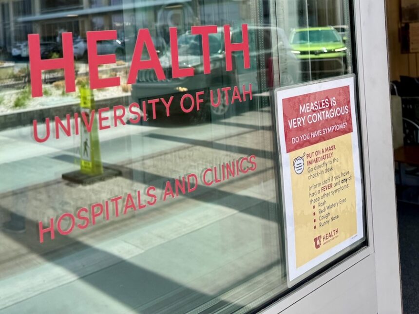 A University of Utah health clinic with a sign warning of measles is pictured in Salt Lake City on June 30, 2025.