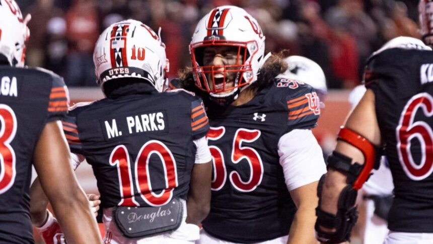 Utah Utes wide receiver Money Parks (10) and Utah Utes offensive lineman Spencer Fano (55) celebrate after a touchdown by Parks during a game between the University of Utah and the TCU Horned Frogs at Rice-Eccles Stadium in Salt Lake City on Saturday, Oct. 19, 2024. The TCU Horned Frogs defeated the Utah Utes 13-7. (Photo courtesy of Brice Tucker, Deseret News)