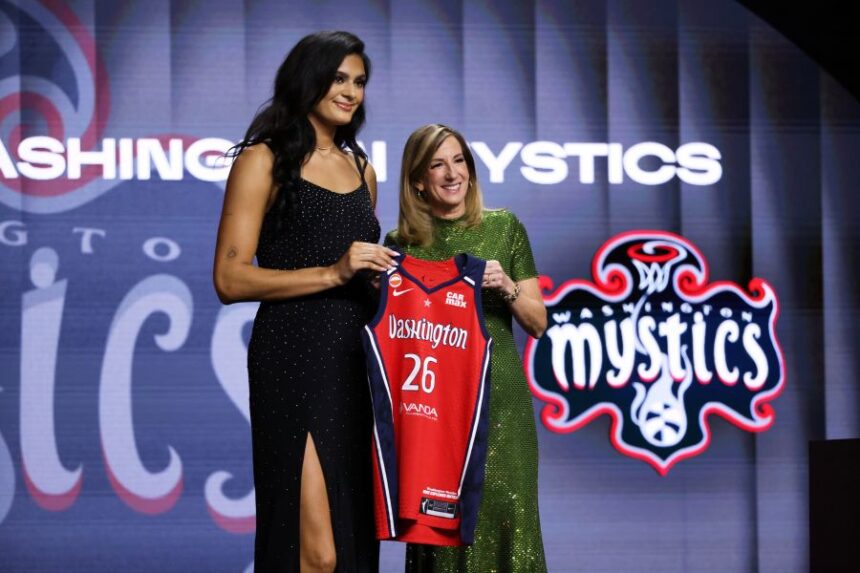UCLA center Lauren Betts poses with WNBA commissioner Cathy Engelbert after being selected fourth overall by the Washington Mystics in the first round of the WNBA basketball draft Monday, April 13, 2026, in New York. (AP Photo/Pamela Smith)