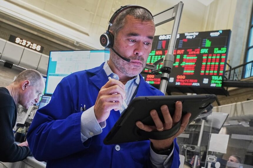 Options trader Justin Kanda works on the floor of the New York Stock Exchange, Thursday, May 7, 2026.