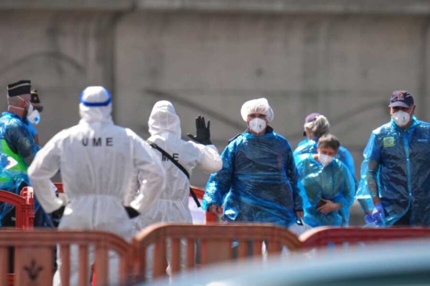 Passengers are disembarked from the hantavirus-stricken cruise ship MV Hondius at the port of Granadilla in Tenerife, Canary Islands, Spain, Sunday, May 10, 2026.