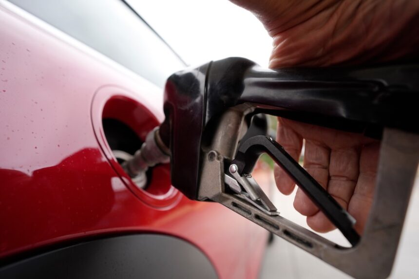 FILE - A motorist pumps fuel at a Shell station Wednesday, July 5, 2023, in Englewood, Colo.