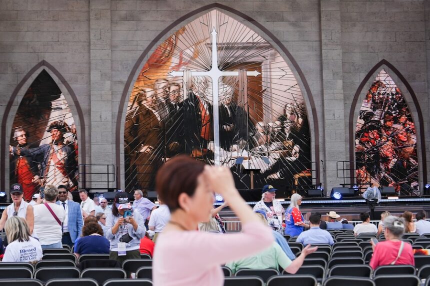 A person prays during Rededicate 250, a mostly conservative Christian prayer gathering in honor of the United States' 250th anniversary, on the National Mall, Sunday, May 17, 2026, in Washington.