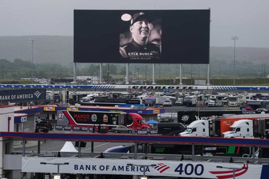 An in memoriam photo of former driver Kyle Busch is displayed on the video board of the backstretch at Charlotte Motor Speedway, Friday, May 22, 2026, in Charlotte, N.C.