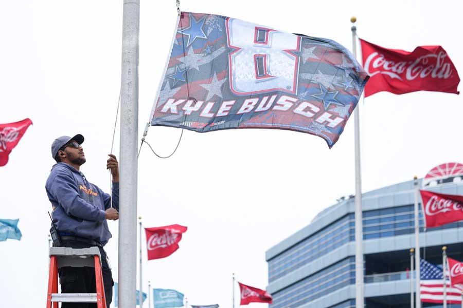 A flag is raised in honor of the late driver Kyle Busch outside of Charlotte Motor Speedway, Friday, May 22, 2026, in Charlotte, N.C.