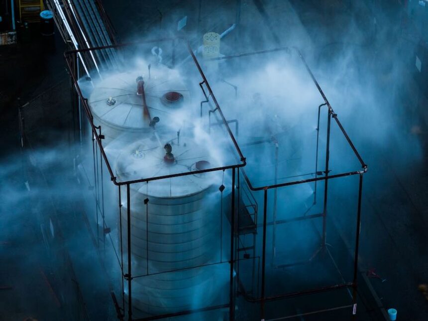 Water is sprayed on a tank that overheated at an aerospace plant in Garden Grove, Calif., Friday, May 22, 2026.
