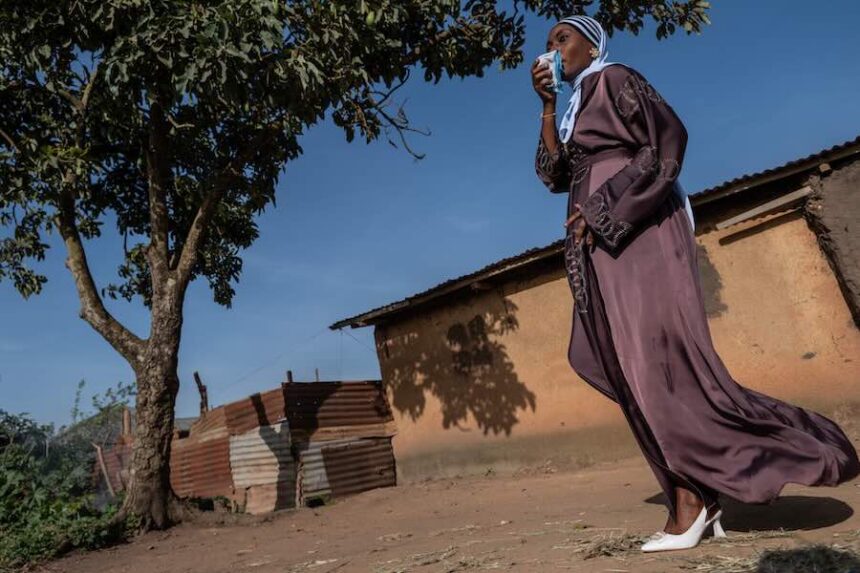 A Muslim woman walks towards the prayer grounds at Sayo Muhamed School to perform Eid al-Adha prayers amid an Ebola outbreak in Bunia, Congo, Wednesday, May 27, 2026.