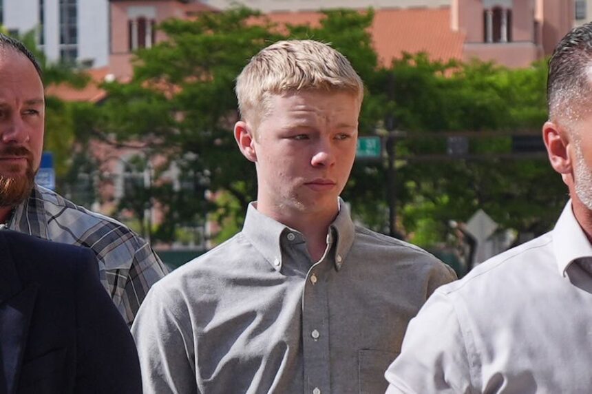 Timothy Hudson, center, charged with sexually assaulting and killing his 18-year-old stepsister on a Carnival Cruise ship, arrives for a hearing at the The James Lawrence King Federal Justice Building, Wednesday, May 27, 2026, in Miami.