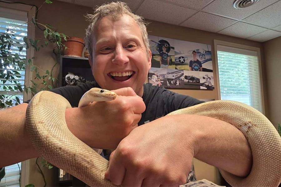 Robert Patten of EastIdahoNews.com holds a snake.
