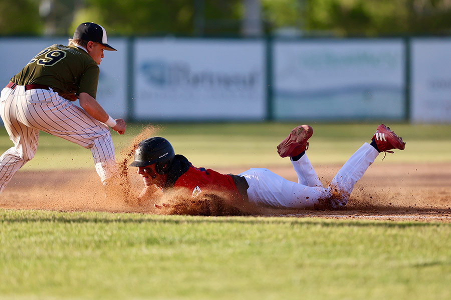 Runnin's Rebels Camdyn Reynolds triples against Rigby Mustangs