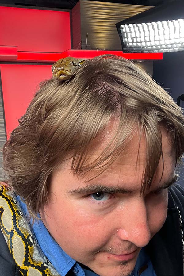 Cody Roberts of EastIdahoNews.com holds a snake.