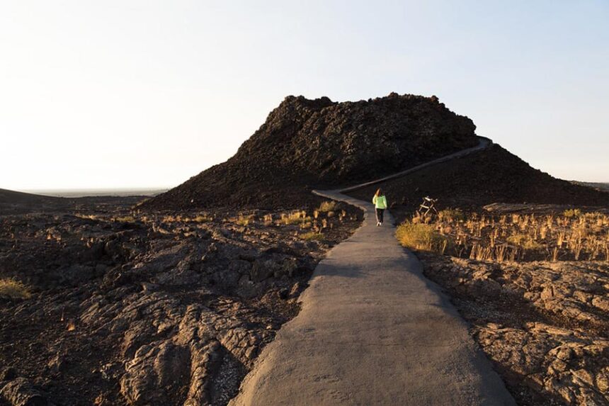 A visitor explores the Spatter Cones Trail at Craters of the Moon National Monument and Preserve. | Courtesy National Park Service