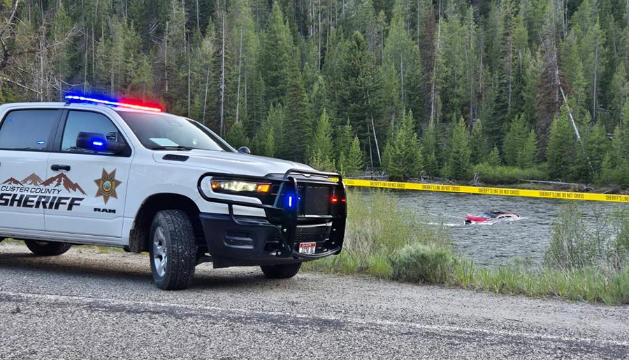 Deputies work to rescue three people after their car ended up in the Salmon River near Stanley by Mormon Bend. | Custer County Sheriff's Office